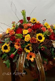 Roses Sunflowers and Pinecones Casket Spray